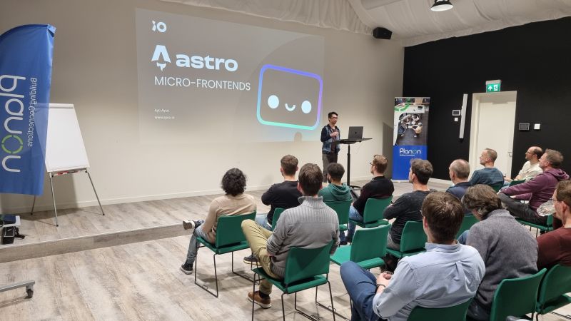 Presenting Astro & Micro-Frontends talk in front of a crowd - [Header image for the post: Astro & Micro-Frontends - Planon Software Development Meetup 2024 - A demonstration of using Astro as shell for a Micro-Frontends architecture]