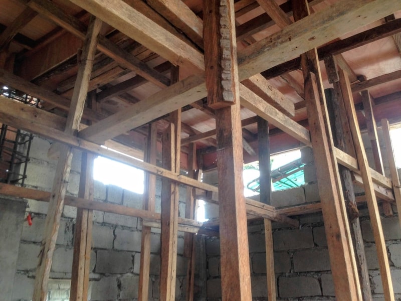 Wooden scaffolding, concrete hollow-blocks and metal brackets in a dim construction site - [Header image for the post: Mind-Numbing Technical Debt - Wrestled with modules after modules with spaghetti imports, and now my current branch has 497 files changed]